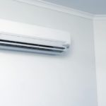 Domestic Air Conditioner Hanging on White Wall